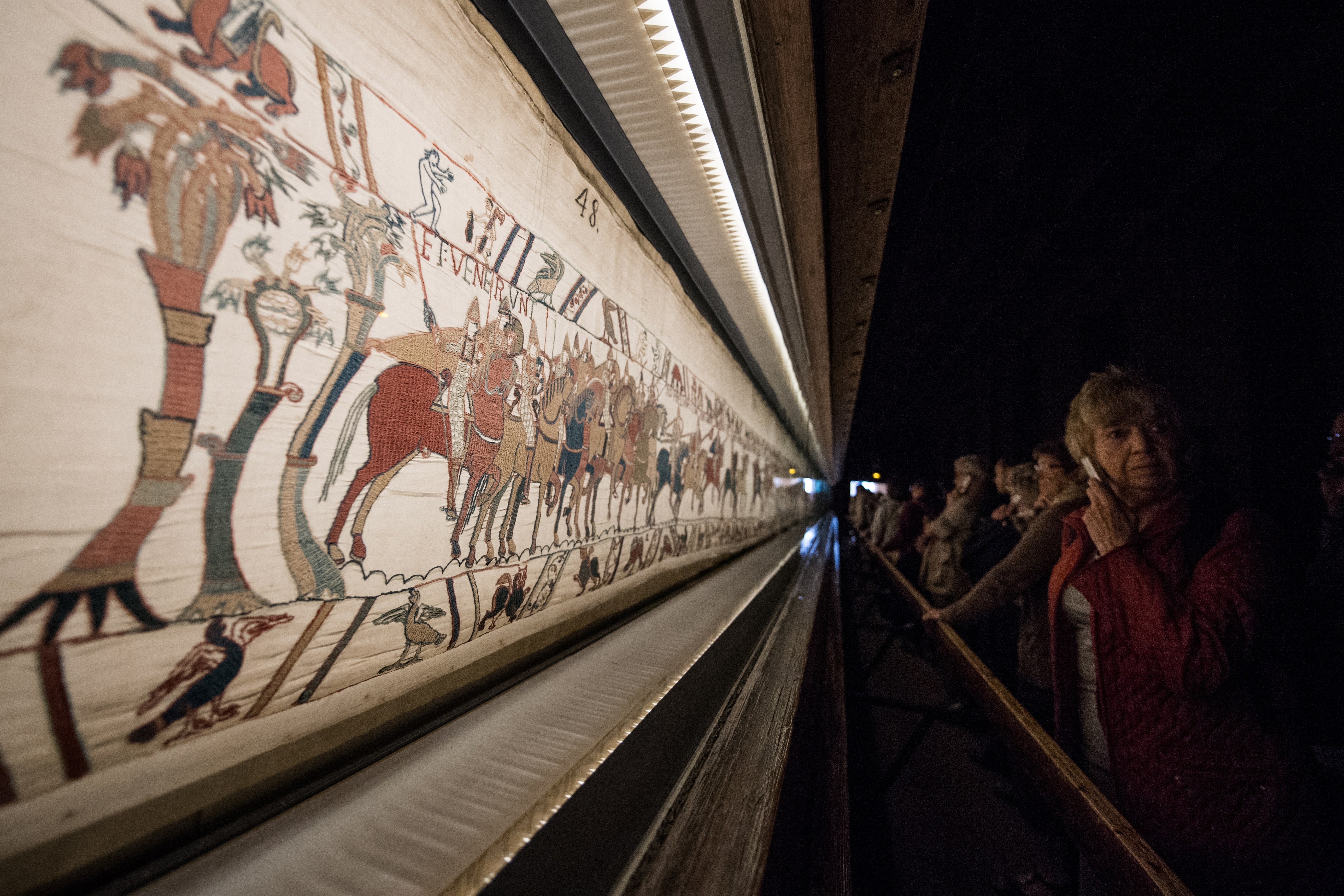 People look at the Bayeux tapestry in Bayeux, western France, on Sept. 13, 2019.