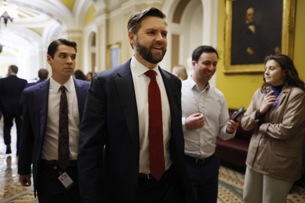 WASHINGTON, DC - FEBRUARY 07: Sen. J.D. Vance (R-OH) (C) leaves a Republican Senate conference meeting at the U.S. Capitol ahead of votes on February 07, 2024 in Washington, DC.