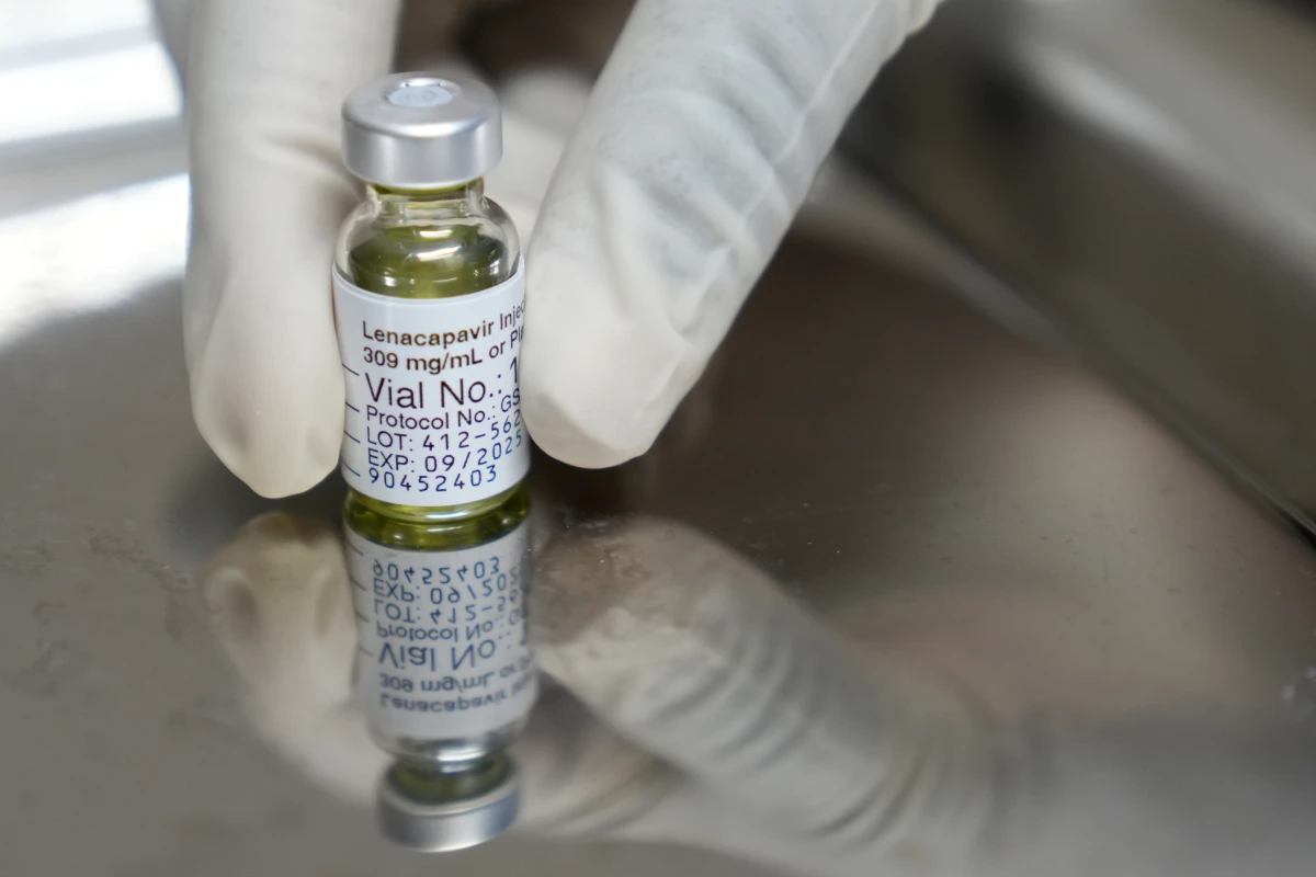 A pharmacist holds a vial of lenacapavir, the injectable drug that prevents HIV infection. On June 18, the FDA approved the drug for use in the U.S.