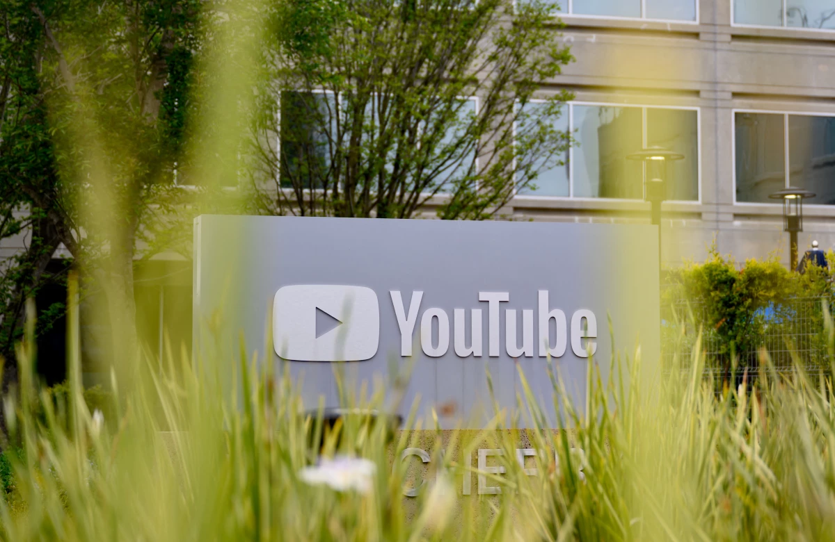 The YouTube logo is displayed on a sign outside the company's corporate headquarters in San Bruno, Calif., in 2025.