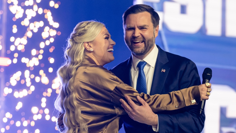 Erika Kirk greets Vice President JD Vance during Turning Point USA's AmericaFest 2025, Sunday, Dec. 21, 2025, in Phoenix.