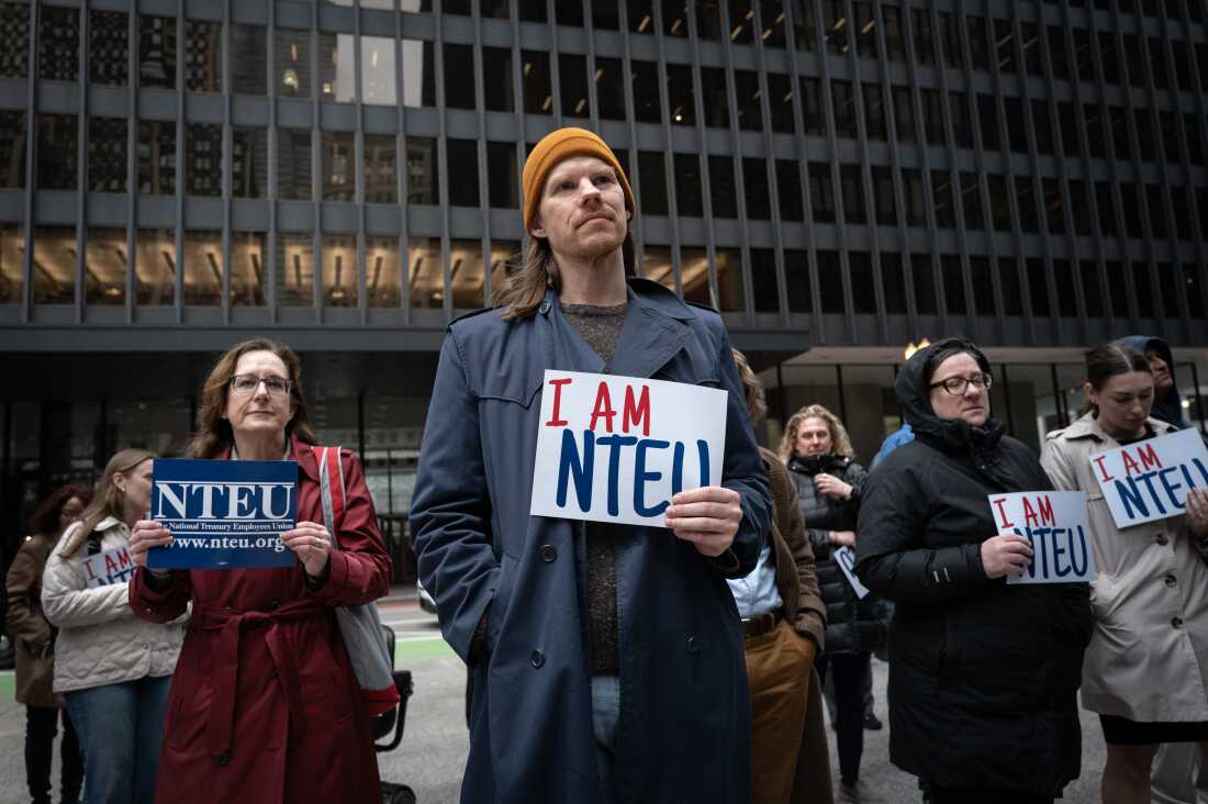 Federal employees rally in support of their jobs outside of the Kluczynski Federal Building on March 19, 2025 in Chicago, Ill. The rally was organized by the National Treasury Employees Union to voice concerns about the Trump administration's mass firing of federal workers.