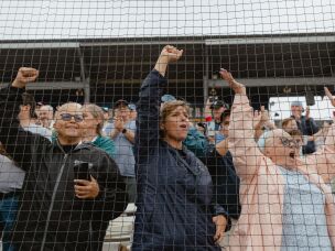 Fans behind home plate during opening day ceremonies on Saturday, Aug. 1.