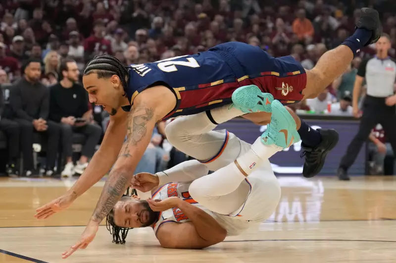 Cleveland Cavaliers guard Jaylon Tyson (20) collides with New York Knicks guard Jalen Brunson (11) during the first half of Game 4 in the Eastern Conference finals NBA basketball playoffs series in Cleveland, Monday, May 25, 2026.