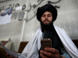 Taliban staff used to rely on smartphones. After a ban was announced, they're using feature phones — also known as