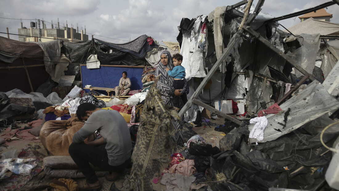 Displaced Palestinians inspect their tents destroyed by Israel's bombardment, adjunct to an UNRWA facility west of Rafah city, Gaza Strip, Tuesday, May 28, 2024.