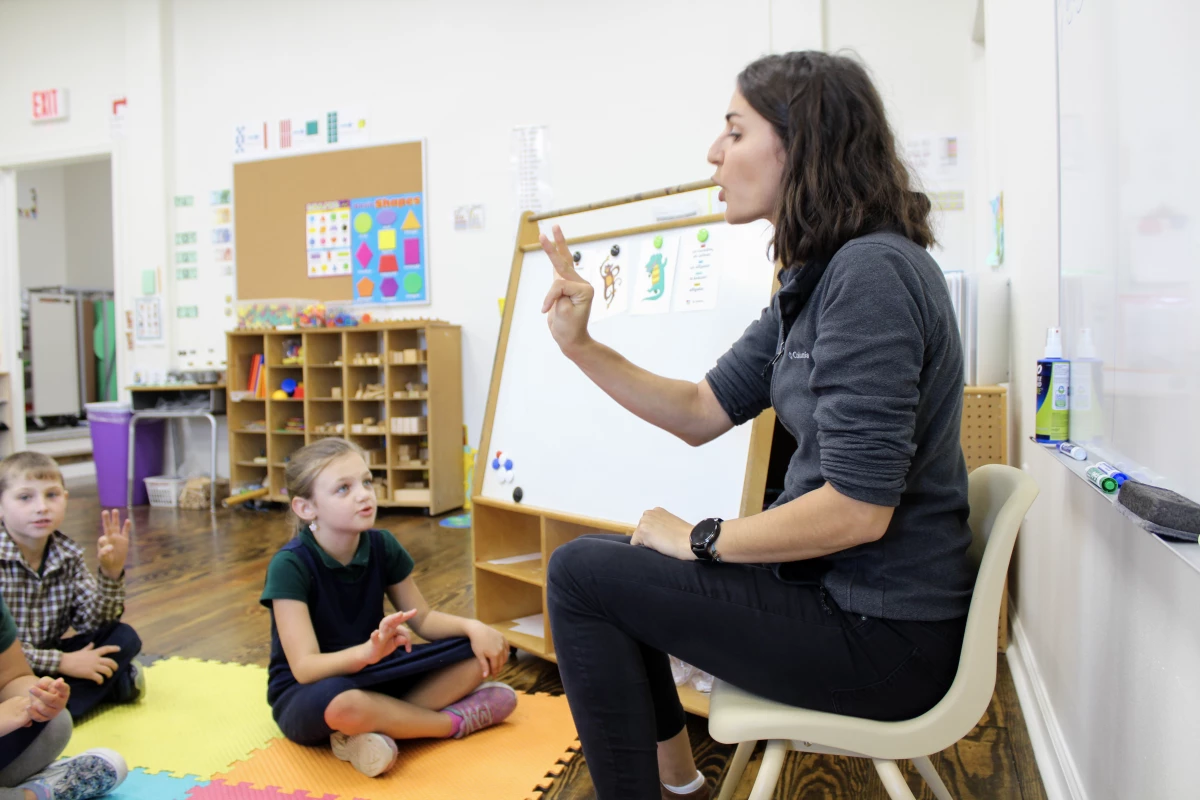 Clotilde Poujade practices French pronunciations with students at École Pointe-au-Chien, a new public French immersion school in Terrebonne Parish, La.