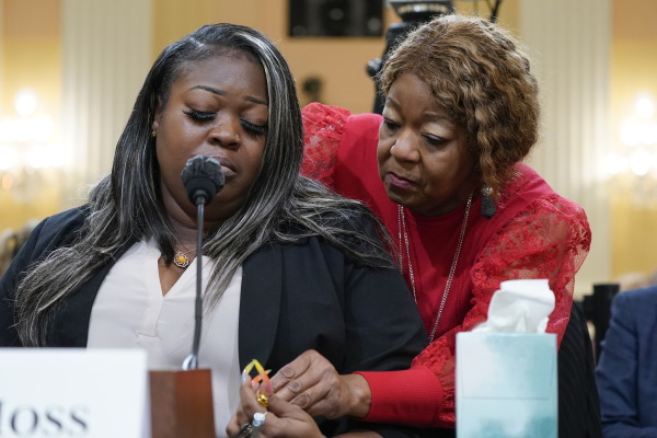 Wandrea "Shaye" Moss, a former Georgia election worker, is comforted by her mother, Ruby Freeman (right), as the House select committee investigating the Jan. 6 attack on the U.S. Capitol continues to reveal its findings of a yearlong investigation at the Capitol in Washington on June 21, 2022.
