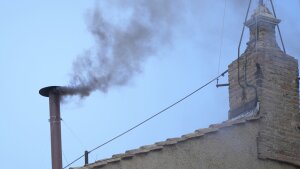Black smoke billows from the chimney of the Sistine Chapel during the conclave to elect a new pope, at the Vatican, Thursday, May 8, 2025.