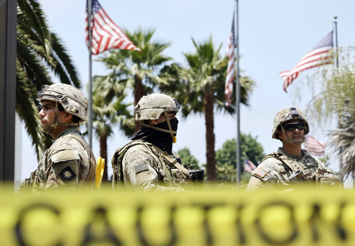 California National Guard members stand guard at the Wilshire Federal Building on June 13, 2025 in Los Angeles, California.