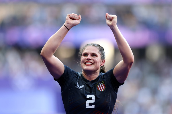 Maher lifts her hands in celebration after Team USA's rugby sevens victory.