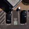 In an aerial view, electric cars sit parked at a charging station in Corte Madera, Calif., on May 15. Federal tax credits that have encouraged the purchase of electric vehicles could be phased out, depending on what happens with negotiations over the Republican tax and spending package currently before the Senate.