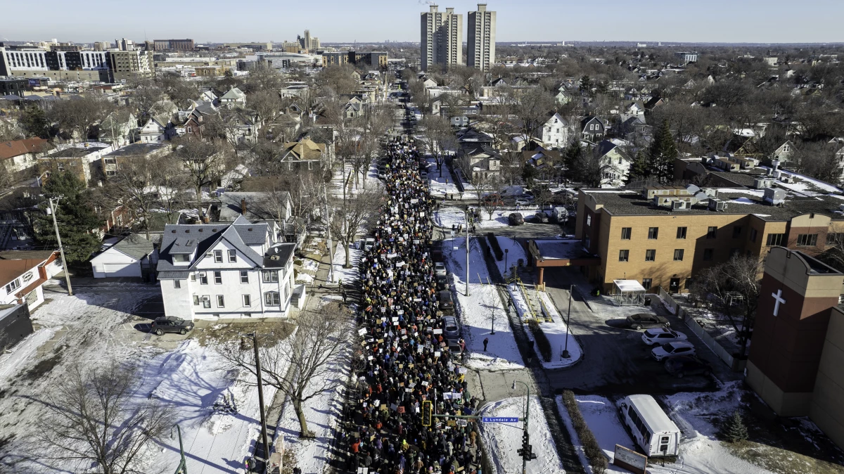 Protesters stage a march calling for an end to taxpayer spending on ICE and demanding a moratorium on evictions on Jan. 31 in Minneapolis.