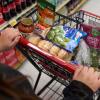 A California's SNAP benefits shopper pushes a cart through a supermarket in Bellflower, Calif., Feb. 13, 2023.