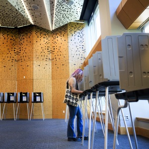 A voter casts her ballot in Colorado's primary election at Denver's Central Library on June 30.
