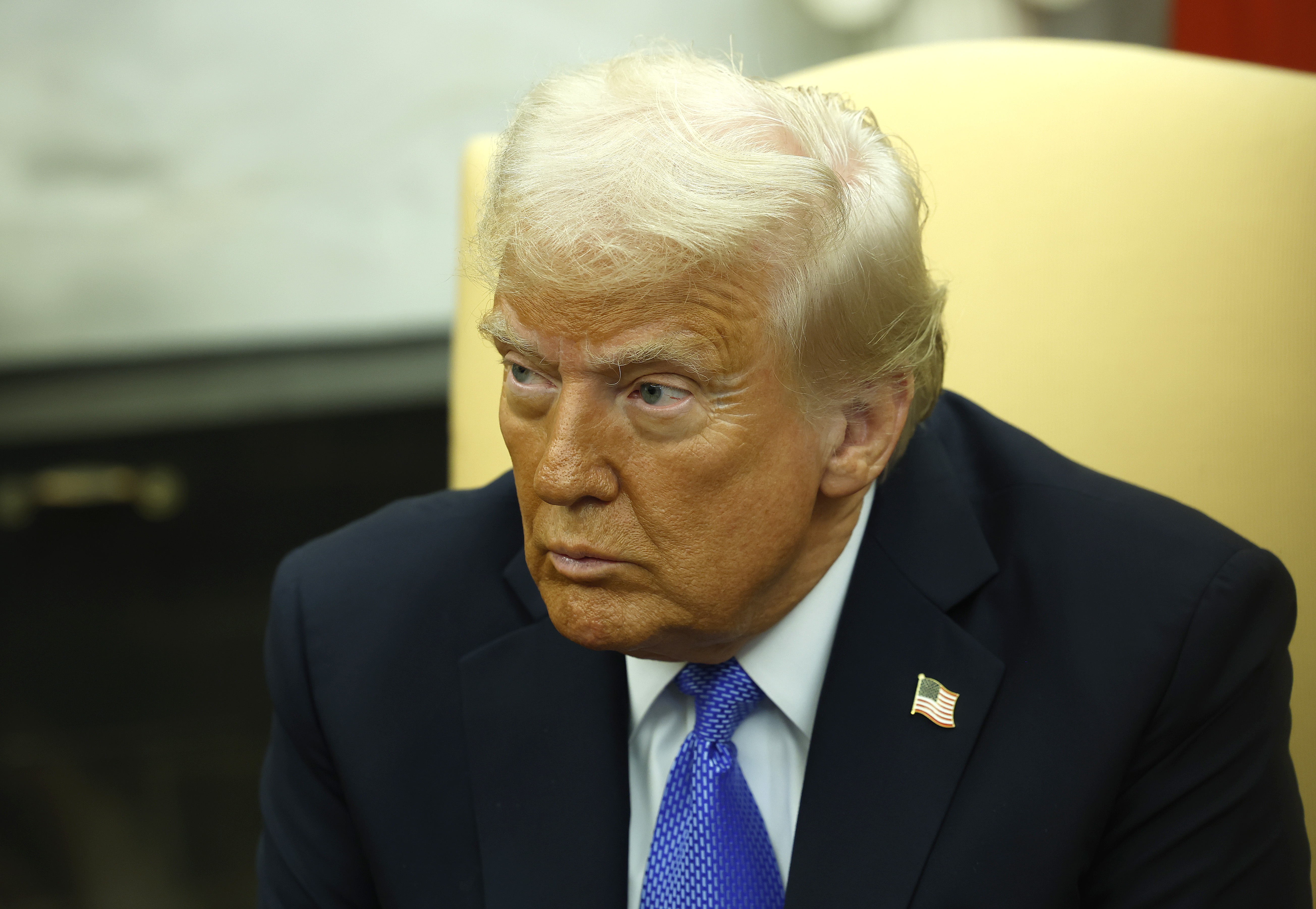 President Trump delivers remarks in the Oval Office on Friday. In a posting on his Truth Social site, Trump said he was revoking former President Joe Biden