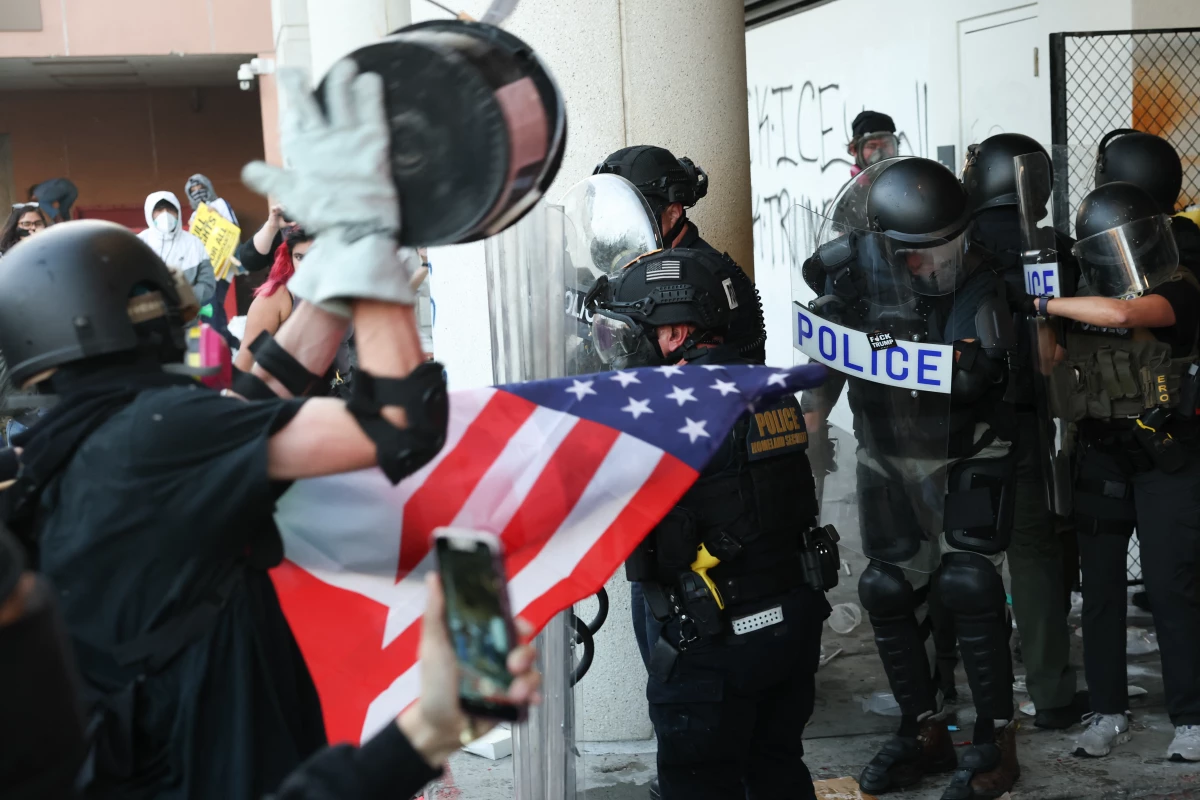 Protesters throw trash and objects as they clash with federal agents and police during a 'National Shutdown' protest against Immigration and Customs Enforcement in Los Angeles on Jan. 30, following the shooting deaths of two U.S. citizens by federal agents in Minneapolis.