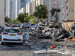 Burnt out vehicles in Ashkelon, southern Israel, are pictured following a rocket attack from the Gaza Strip on Oct. 7, 2023.
