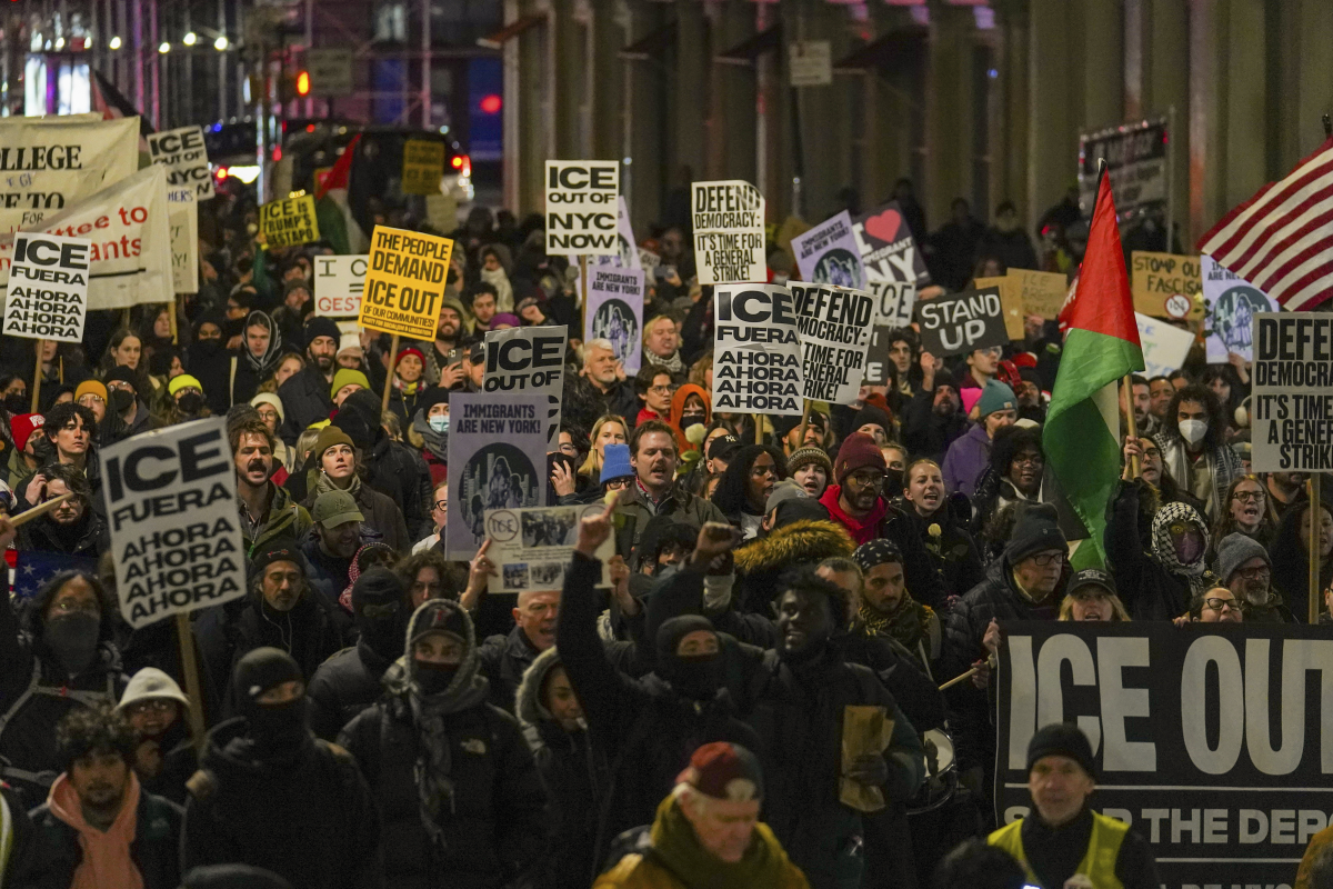 In New York on Wednesday, people participate in a protest in response to the fatal shooting of Renee Nicole Good in Minneapolis.