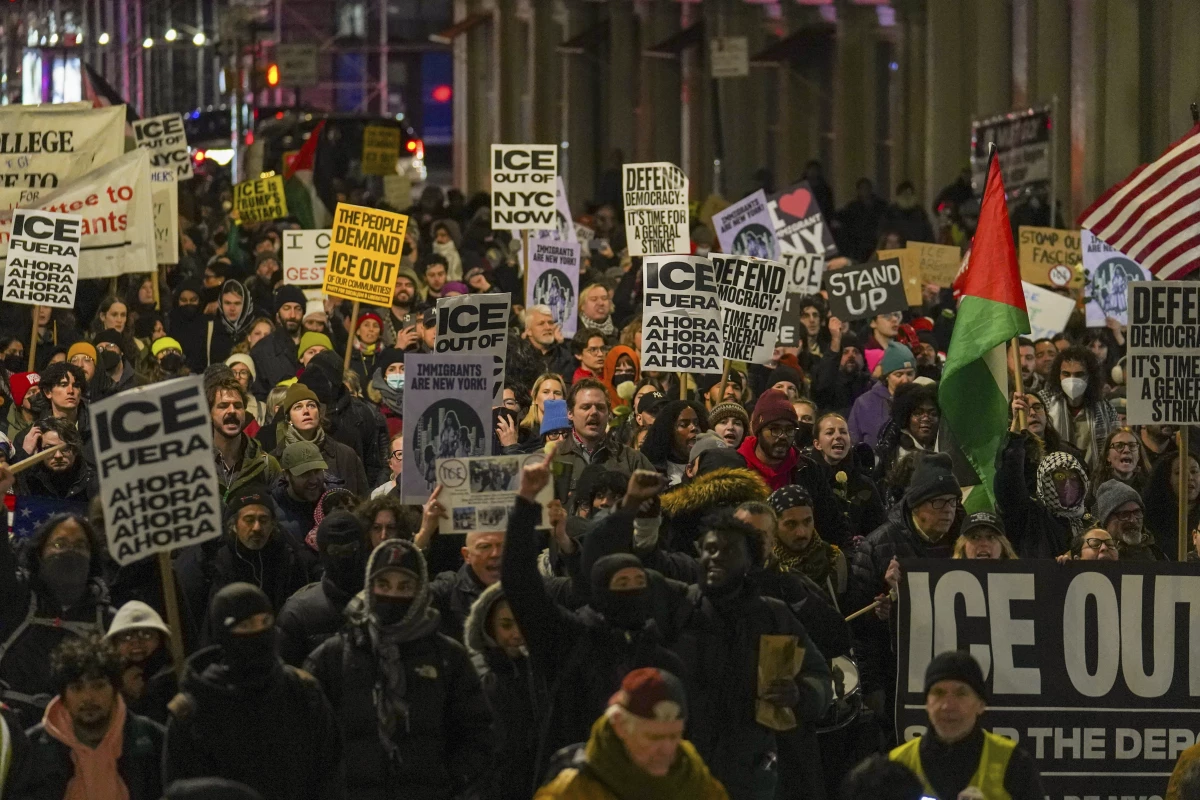 In New York on Wednesday, people participate in a protest in response to the fatal shooting of Renee Nicole Good in Minneapolis.
