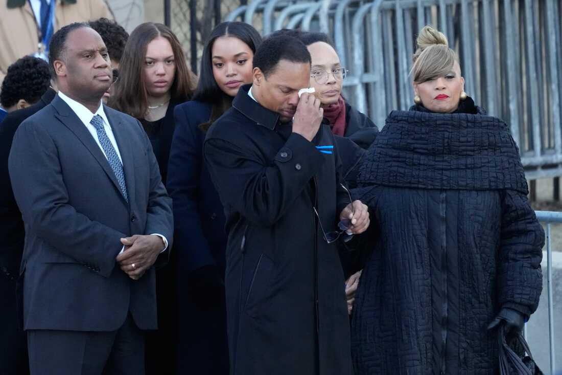 The family of the Rev. Jesse Jackson arrives as Yusep Jackson wipes his eyes before public visitation at Rainbow/PUSH Coalition in Chicago on Thursday.