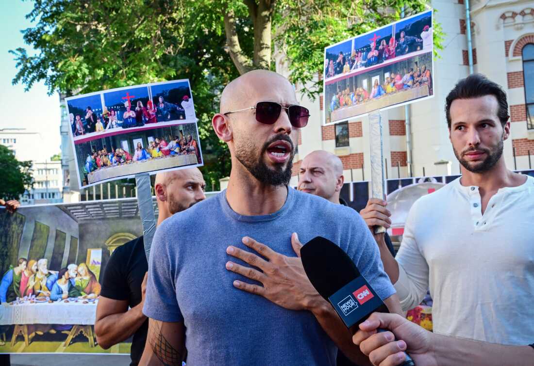 Andrew Tate and his brother Tristan Tate speak during a protest against the Olympics next to the French Embassy to Romania in Bucharest, on July 28, 2024. The Tate brothers criticized the Paris 2024 Olympic Games for the inclusion message offered during the opening ceremony.