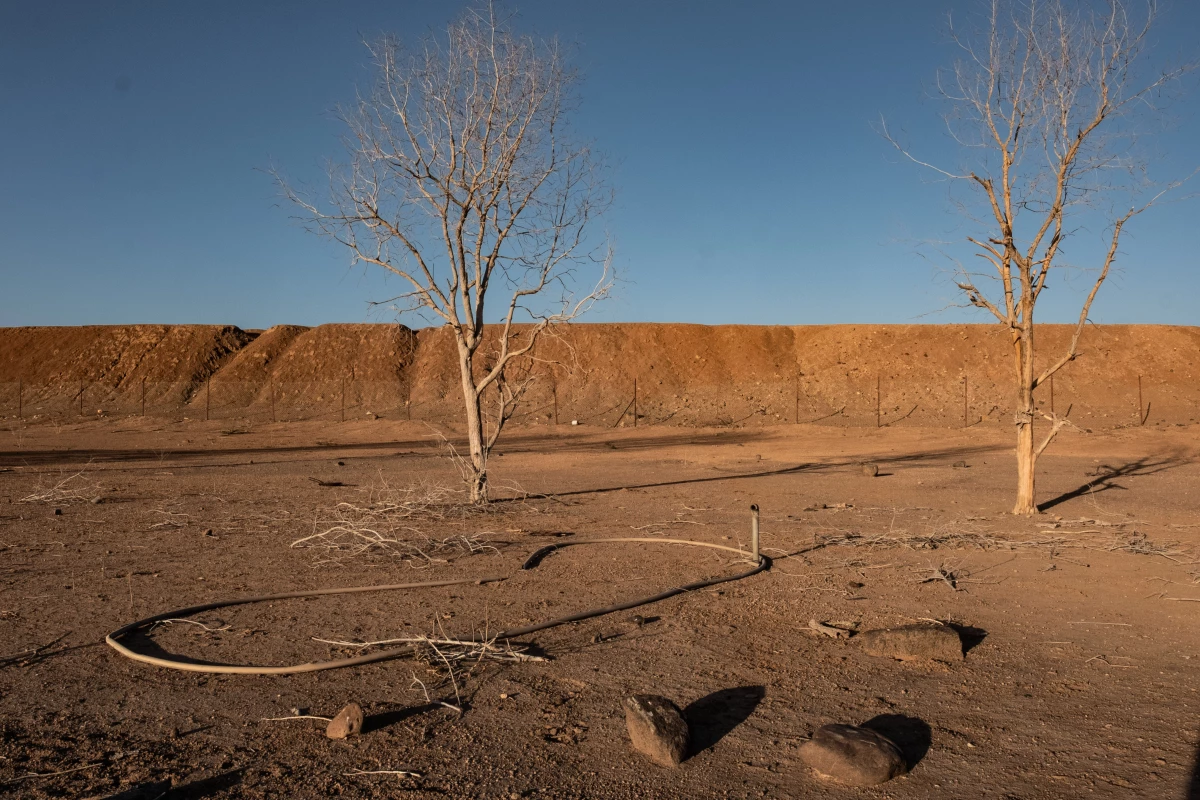 Sections of a broken irrigation system in what was once a thriving community farm backed by the Great Green Wall initiative in Kourtimale, Djibouti. The farm's irrigation system failed, and the land reverted to desert.