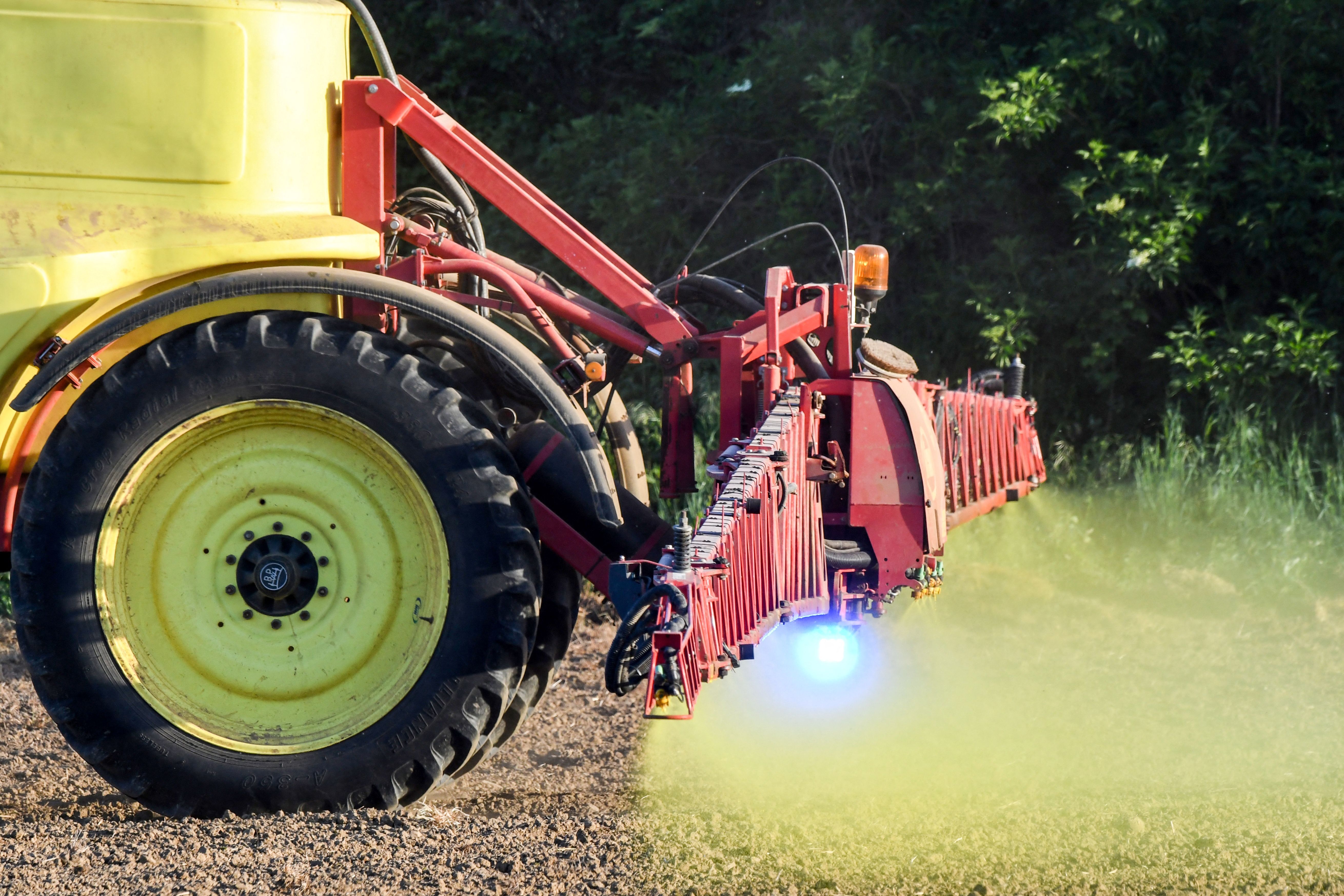A French farmer sprays Roundup 720 glyphosate herbicide produced by U.S. agrochemical giant Monsanto in 2018 on a field of no-till corn in northwestern France. The U.S. Supreme Court on Monday heard a dispute over labels on the popular Roundup pesticide, which thousands of plaintiffs blame for their cancers.