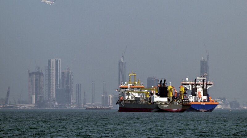 Commercial vessels offshore in Dubai on March 11, 2026. Attacks hit three commercial ships in the Gulf on March 11 as Iran pressed its campaign against its oil-exporting neighbors, threatening shipping in the Strait of Hormuz. 