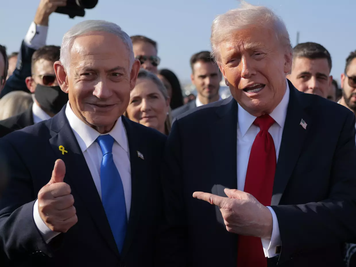 President Trump speaks to Israeli Prime Minister Benjamin Netanyahu at Israel's Ben Gurion International Airport on Oct. 13, 2025. Trump visited the country as part of a ceasefire agreement in the Israel-Hamas war in Gaza.
