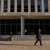 A person walks past the U.S. Department of Education in Washington, DC.