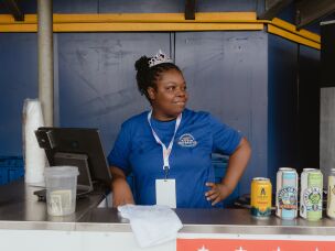 A concessions stand worker at Springfield's Robin Roberts Stadium awaits her first customers on WPBL's opening day.