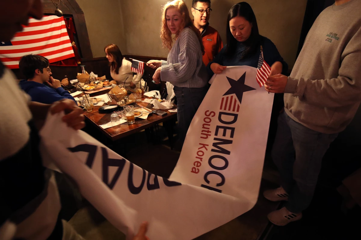 Members of Democrats Abroad South Korea gather for a November 2024 election watch party in Seoul, South Korea.