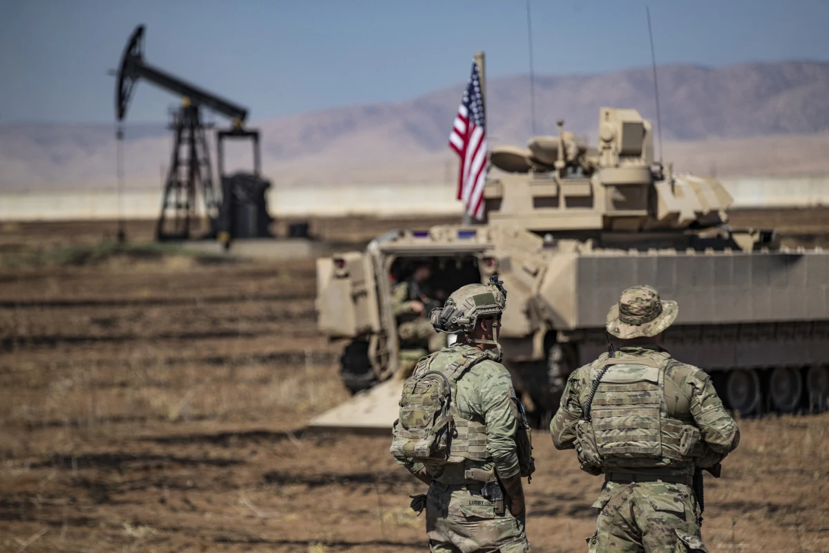 U.S. forces patrol oil fields in northeastern Syria in September 2024. The U.S. troops lead a coalition that defeated Islamic State forces in the region and have remained to prevent a resurgence of the extremist group. President Trump considered withdrawing the U.S. forces in his first term, but decided against it. He hasn't yet said what he intends to do in his second term.