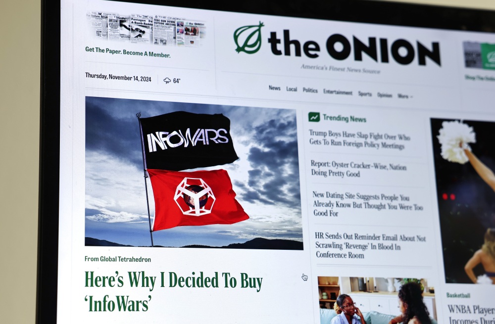 The Onion's home page on Nov. 14 featured a satirical story titled, "Here's Why I Decided To Buy 'InfoWars' " following the bankruptcy auction as part of Alex Jones' defamation settlement over the massacre at Sandy Hook Elementary School. (Getty Images)