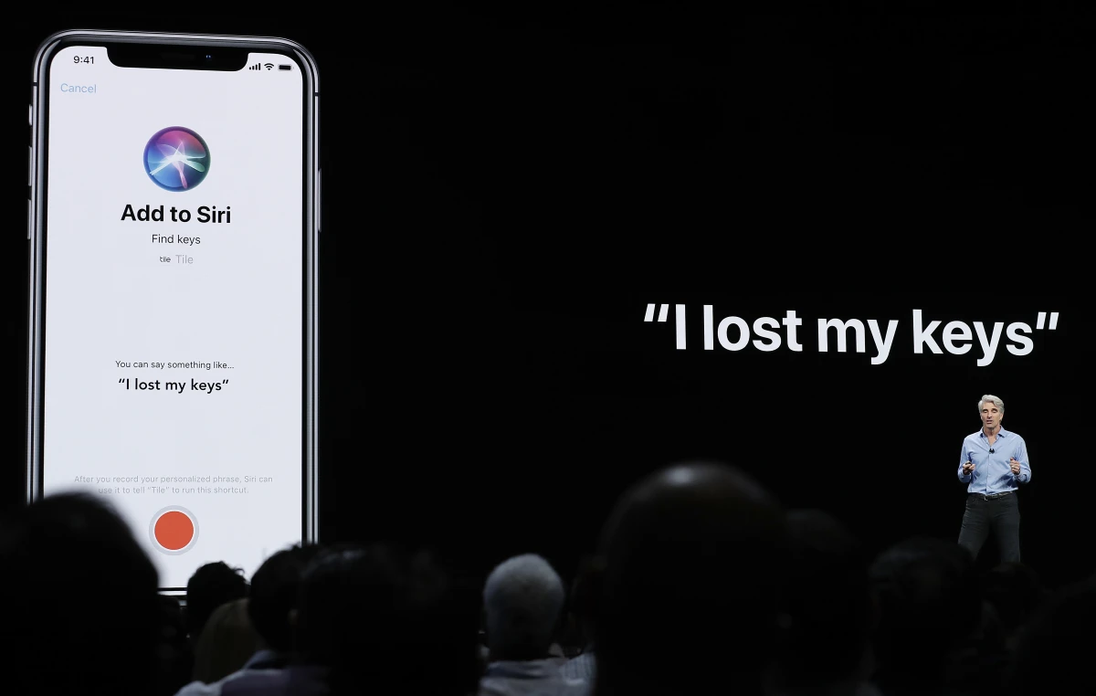 Craig Federighi, Apple's senior vice president of Software Engineering, speaks about Siri during an announcement of new products at the Apple Worldwide Developers Conference in San Jose, Calif., June 4, 2018.