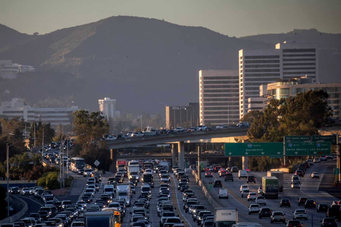 Traffic moves along the 405 Freeway on February 13, 2026 in Los Angeles, California.