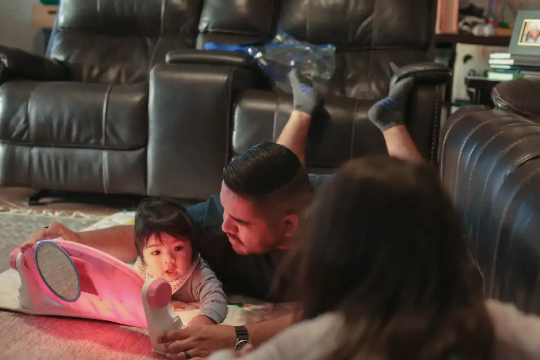 Karlo Campana plays with his new son Gianluca as his wife Lily prepares dinner in Santa Ana, Calif. “You need that adjustment period,” he said.