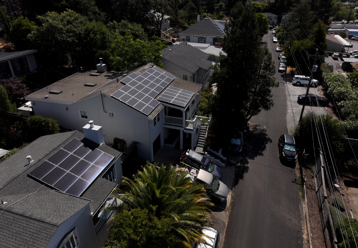 Solar panels on rooftops in California. The use of solar plus batteries helped California prevent blackouts in 2022 when there was a heatwave and gas plants were under performing.
