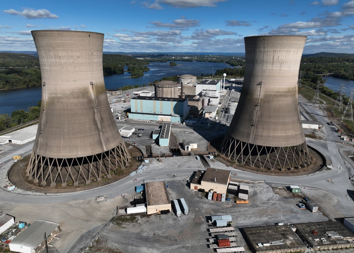 The shuttered Three Mile Island nuclear power plant stands in the middle of the Susquehanna River on October 10, 2024. One of the plant's two reactors partly melted down in 1979, but the second one operated for decades before it was closed. It is now set to be restarted as early as 2028, pending approval by the Nuclear Regulatory Commission.