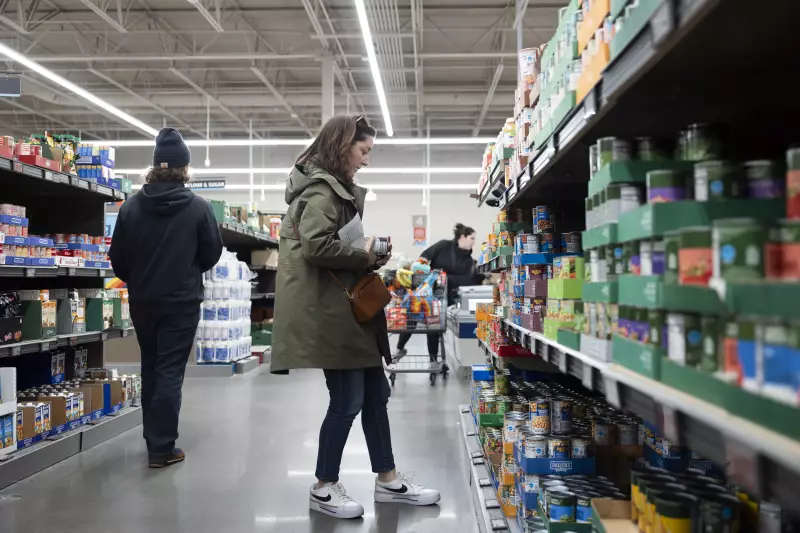 Rachel Negro-Henderson stands in an aisle, looking at shelves of canned food, at the Aldi in Bellmawr, New Jersey, on March 2.
