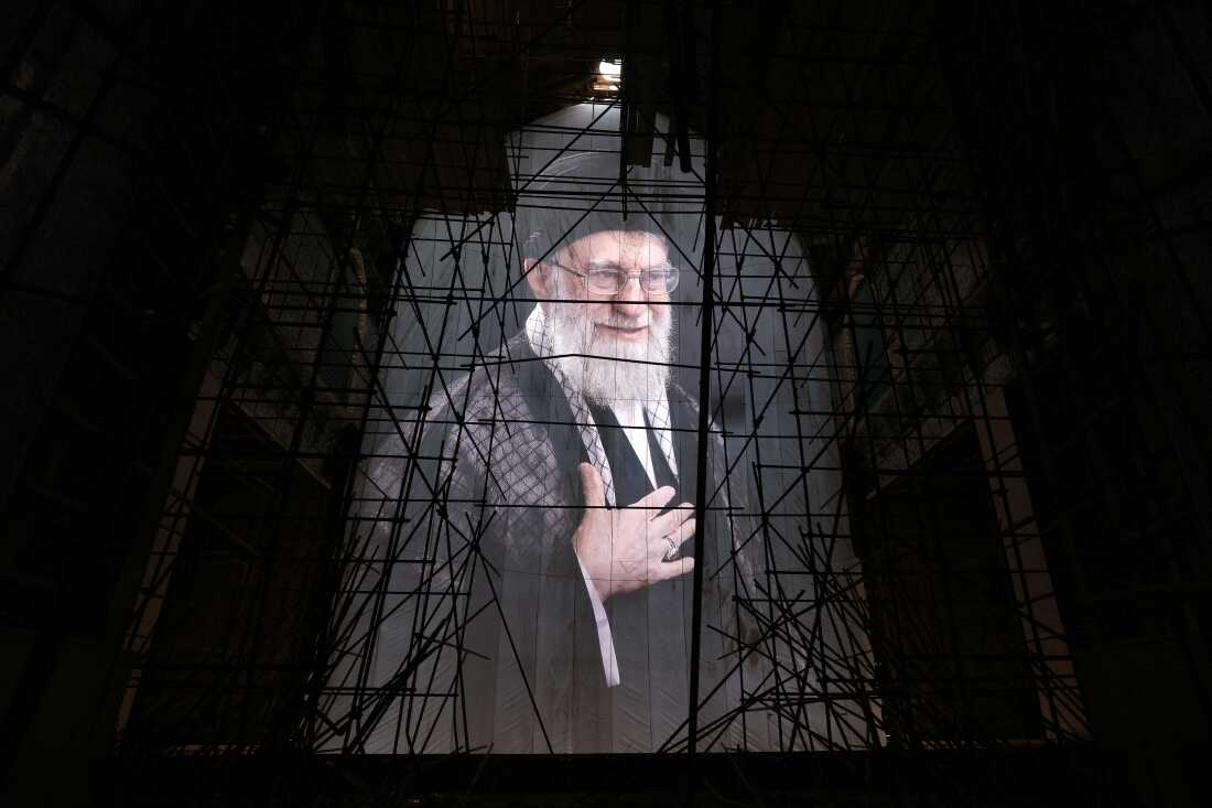 A picture of Iran's slain supreme leader, Ayatollah Ali Khamenei, is seen at the Grand Mosalla during his funeral ceremonies in Tehran on Saturday.