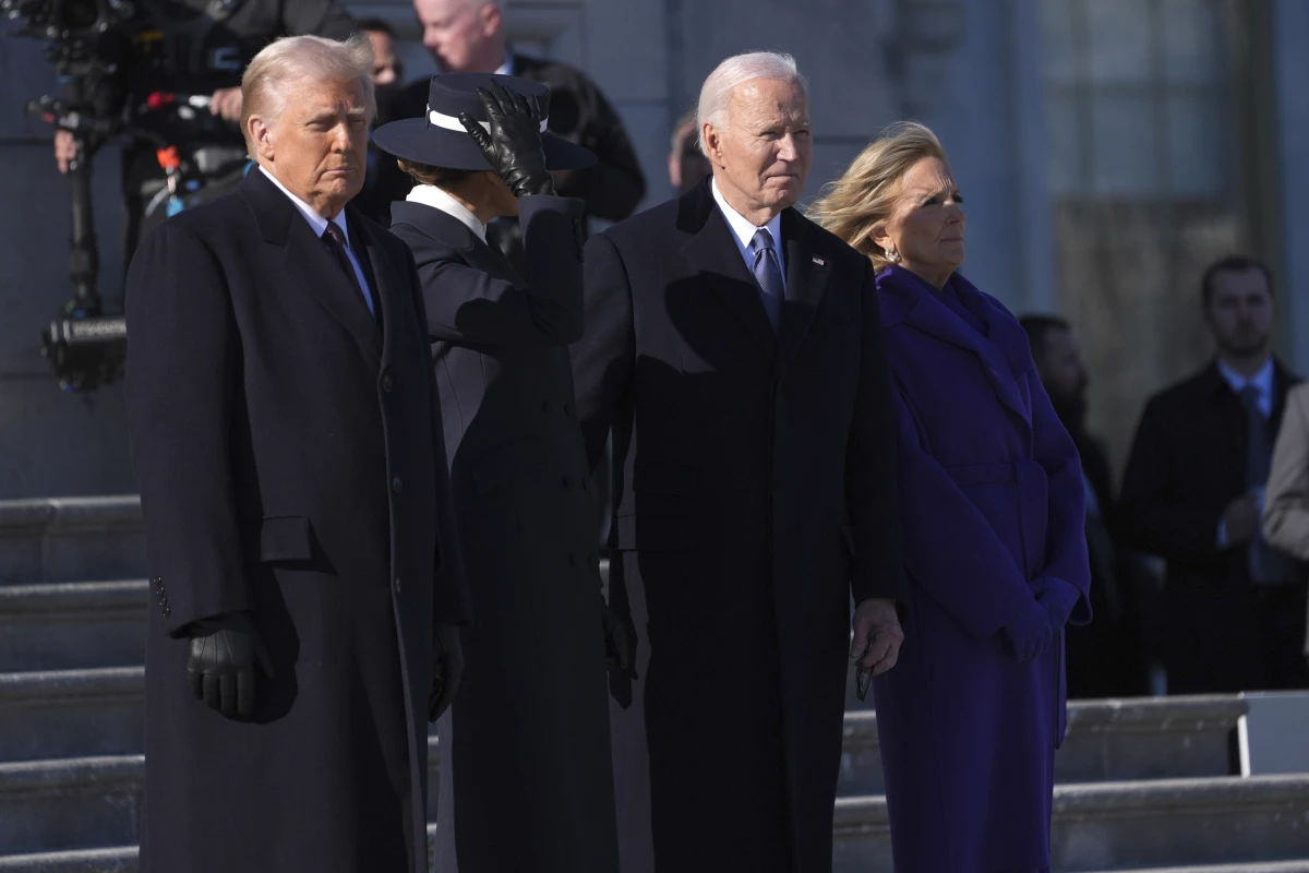 President Trump and first lady Melania Trump stand before sending off former President Joe Biden and Jill Biden to board a Marine helicopter en route to Joint Base Andrews after the inauguration on Jan. 20, at the U.S. Capitol in Washington.