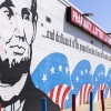 A man walks outside Lincoln Liquor & Wine on Monday in Oak Park, Mich.