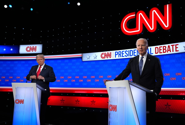 Republican presidential candidate, former U.S. President Donald Trump (L) looks at U.S. President Joe Biden during the CNN Presidential Debate at the CNN Studios on June 27, 2024 in Atlanta, Georgia.