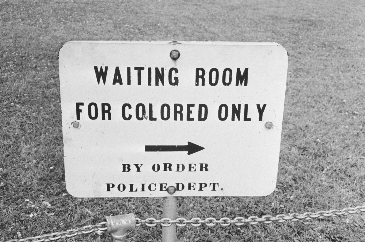A sign in Jackson, Miss., in May 1961. The contract clause deleted from federal regulations last month dated back to the mid-1960s and specifically said entities doing business with the government should not have segregated waiting rooms, drinking fountains or transportation.