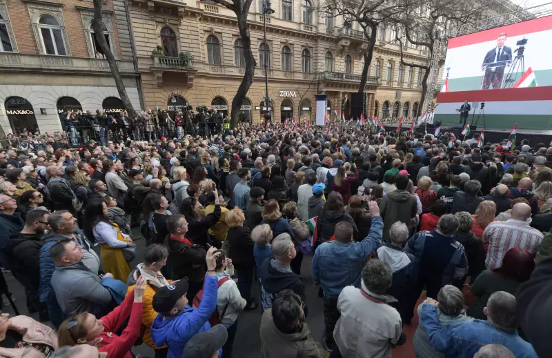 Standing outdoors on a stage in front of a large crowd of people, Péter Magyar delivers a speech during a demonstration in Budapest, Hungary, on March 15, 2024.
