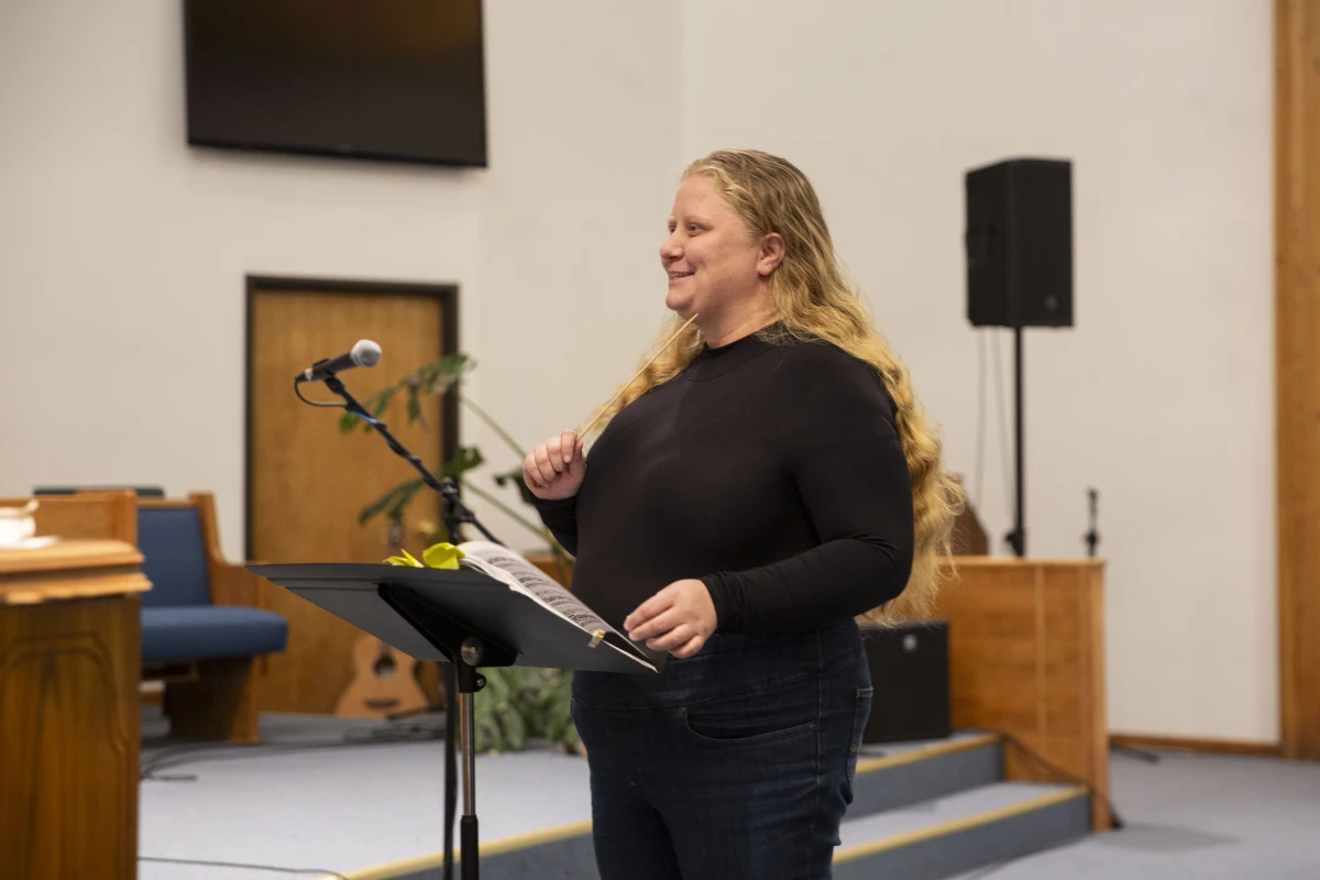 Music director Stephanie Helleckson, who has spent most of her life in Paonia, leads community choir practice at the church.
