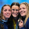 From left, U.S. silver medalist Regan Smith, Australian gold medalist Kaylee McKeown and U.S. bronze medalist Katharine Berkoff pose with their medals following the women's 100-meter backstroke swimming event during the Paris 2024 Olympic Games on Tuesday.