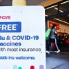 A person enters a CVS store in Monterey Park, California, where flu and COVID-19 vaccines are offered.